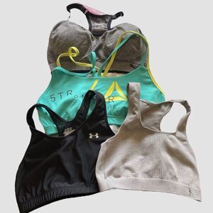 Women Size Medium 4 bundle Sports Bra's Reebok, Under Armour, Puma, Danskin